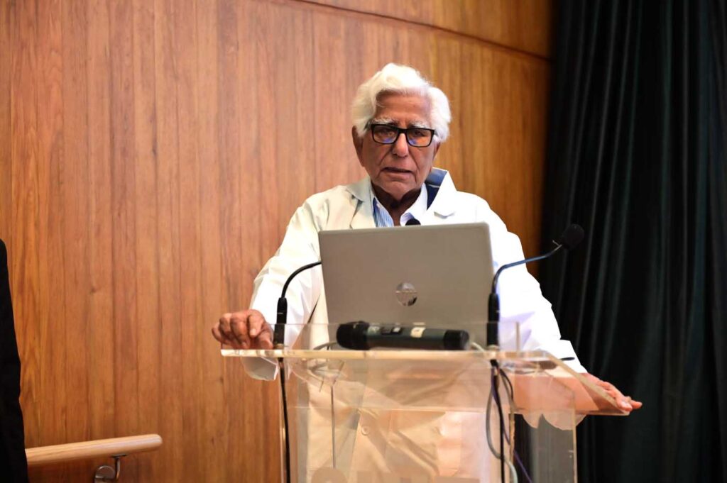 dr adib rizvi founder and director of the siut address the siut volunteer program participants