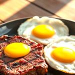 Hot grilled sirloin steak cooked medium-rare, resting on a cutting board, ready to serve.. Explore more about calories in steak and eggs diet