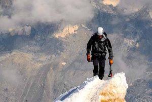 Losing weight on the steak and eggs diet why failed—man in black adventure gear walking across a glacier, reflecting struggle and endurance.