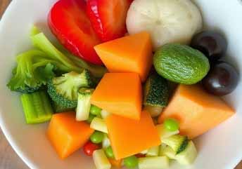 Steamed mixed vegetables and soft fruit bowl — a colorful, braces-friendly lunch with gentle textures and fresh flavors. what foods can you eat with braces