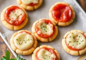 Soft cracker pizza bites topped with melted cheese and sauce — a braces-friendly snack or soup side.