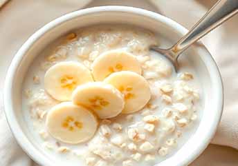 Soft oatmeal with milk and banana slices — a warm, braces-friendly meal served in a cozy bowl. what foods can you eat with braces