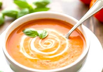 Creamy potato basil soup served warm — a smooth, braces-friendly dish with fresh herbs and velvety texture.