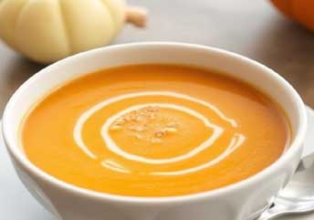 Silky pumpkin soup served warm in a bowl — a smooth, braces-friendly option for cozy autumn meals.