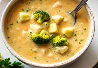 Creamy broccoli and cheese soup served warm — a soft, braces-friendly recipe perfect for comfort and nutrition.
