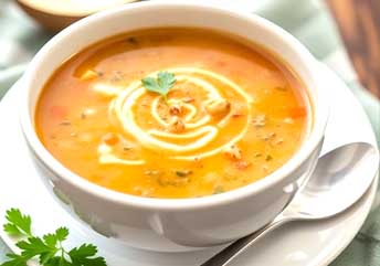 Assorted bowls of delicious, braces-friendly soups including creamy, smooth, and gently textured recipes.